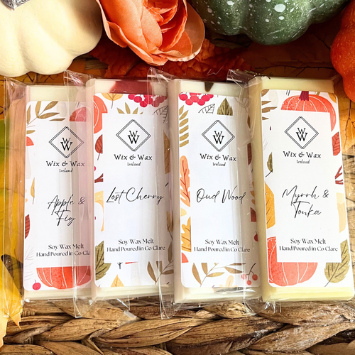 Autumn wax melt bundle featuring a selection of warm, seasonal fragrances in eco-friendly packaging, perfect for creating a cozy, inviting atmosphere at home. myrrh and tonka, apple and fig, lost cherry, oud wood