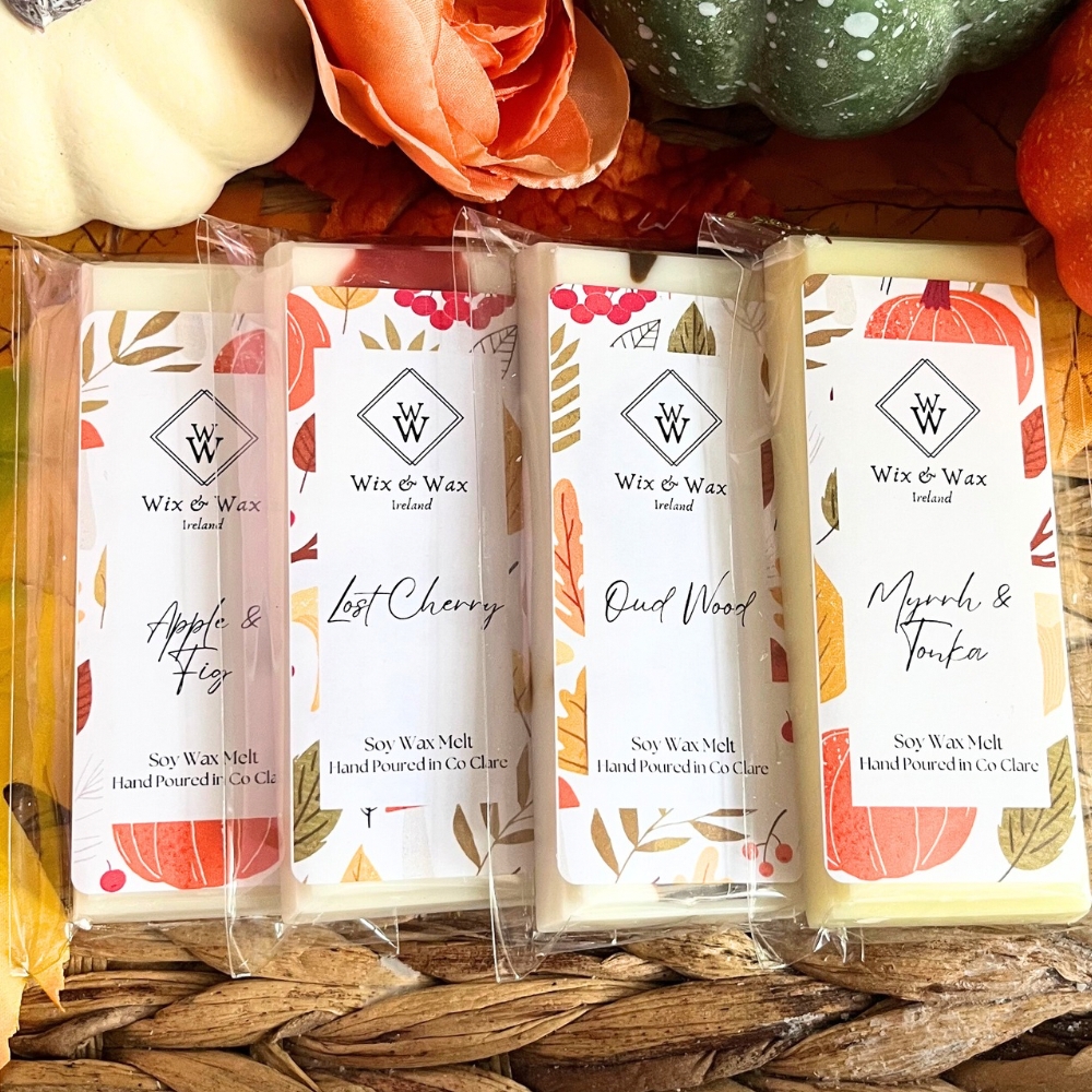Autumn wax melt bundle featuring a selection of warm, seasonal fragrances in eco-friendly packaging, perfect for creating a cozy, inviting atmosphere at home. myrrh and tonka, apple and fig, lost cherry, oud wood