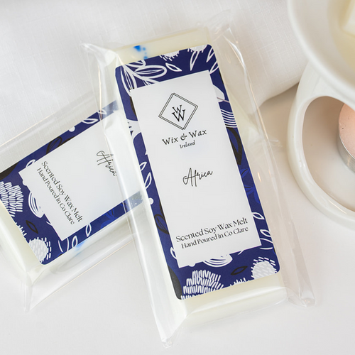 Africa wax melt by Wix and Wax – hand-poured soy blend with a fresh, masculine scent, styled in modern, eco-friendly packaging.
