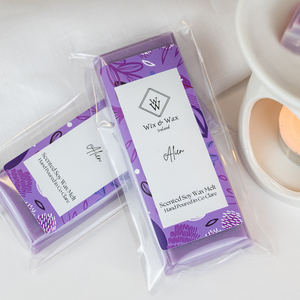 Alien Snap Bar wax melt releasing fragrance in a lit wax burner – cosy home scene by Wix and Wax Ireland