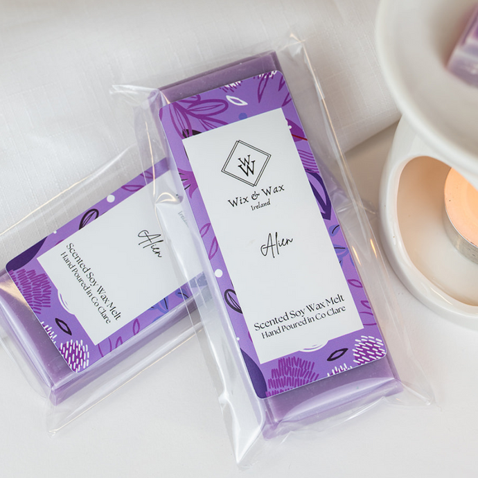 Alien Snap Bar wax melt releasing fragrance in a lit wax burner – cosy home scene by Wix and Wax Ireland