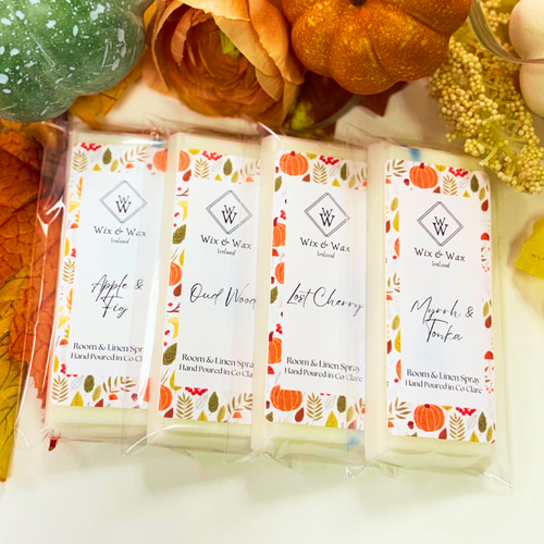 Autumn wax melt bundle featuring a selection of warm, seasonal fragrances in eco-friendly packaging, perfect for creating a cozy, inviting atmosphere at home. myrrh and tonka, apple and fig, lost cherry, oud wood