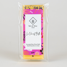 Load image into Gallery viewer, La Vie Est Belle wax melt by Wix and Wax – hand-poured soy blend with a sweet, floral perfume-inspired scent, presented in chic, eco-conscious packaging.
