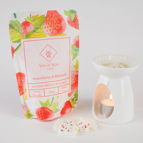 Strawberry & Rhubarb wax melts in a soft pink hue, handcrafted with soy blend wax and bursting with sweet, fruity summer fragrance.

